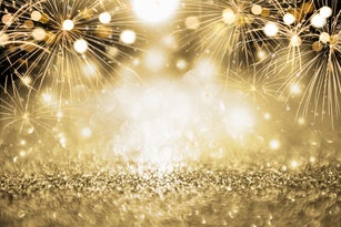 Gold and silver Fireworks and bokeh in New Year eve and copy space. Abstract background holiday.