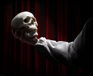 A skull in the hands of an Actor, the tragedy of Hamlet.