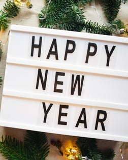 Lightbox with inscription happy new year. Christmas. Festive background.