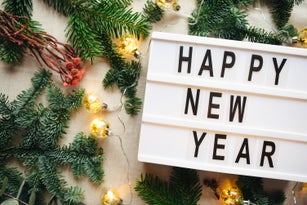 Lightbox with inscription happy new year. Christmas. Festive background.