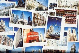 Collection of instant travel holiday photos of London on a table