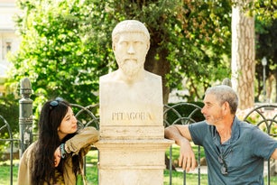 Father and adult daughter posing happily on their vacation in Rome
