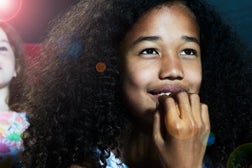 Portrait of girl watching a movie at the cinema