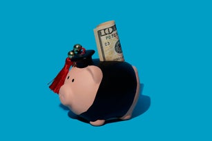 piggy bank wearing an academic dress with a dollar banknote