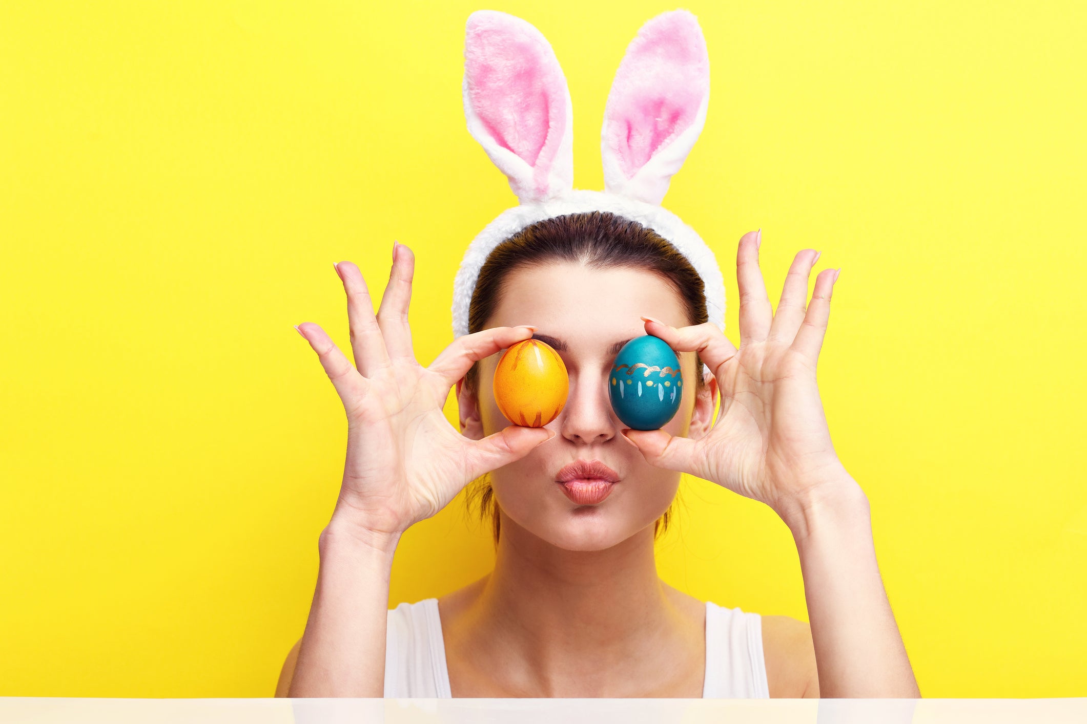 Happy young woman wearing bunny ears