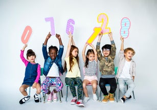 Group of students holding mathematics number