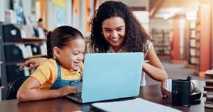 Girl, mom and happy with laptop at library with e learning, support and guide for development with test. People, mother and daughter by computer, scholarship and excited for results with education