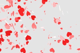 Many red Valentine's day hearts falling on white background. Holiday backdrop for your design. Three dimensional illustration