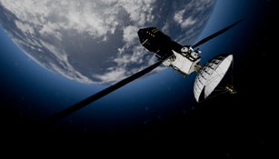 Illustration of a satellite orbits Earth against a backdrop of space and a sunlit horizon