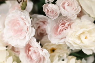 background of artificial pink rose blooms
