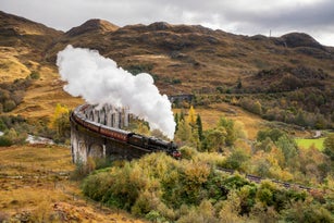 The Jacobite Steam train Crossing the Glenfinnan Viaduct in Scotland.