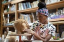 Female sculptor working in her art studio