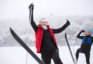 Senior couple cross-country skiing.