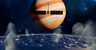 Clipper spacecraft on a flyby over Europa’s surface with Jupiter rising in the background. Moon