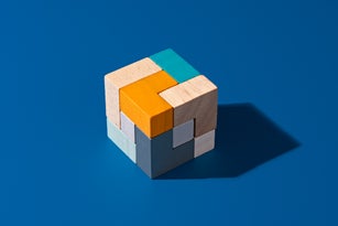 Completed Wooden Puzzle on Blue Background