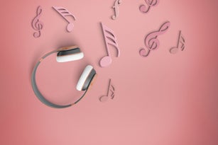 headphones and musical notes in pink background