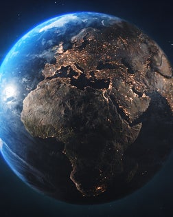 Planet Earth Seen From Space. View of Europe, Asia, & Africa with City Lights at Night