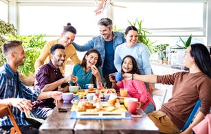 Young people drinking and eating at coffee bar - Friends talking and having fun together at fancy cafeteria - Friendship life style concept with happy guys and girls at restaurant cafe - Bright filter