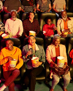 Happy audience enjoying at cinema hall