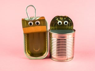 Concept of love, romanticism and diversity. Two open tin cans with eyes