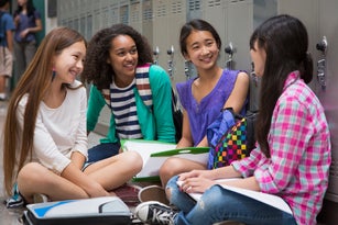 Students talking in school corridor