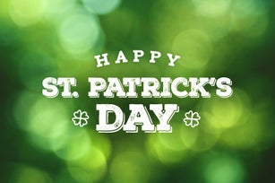 Happy St. Patrick's Day Text Over Green Bokeh Lights