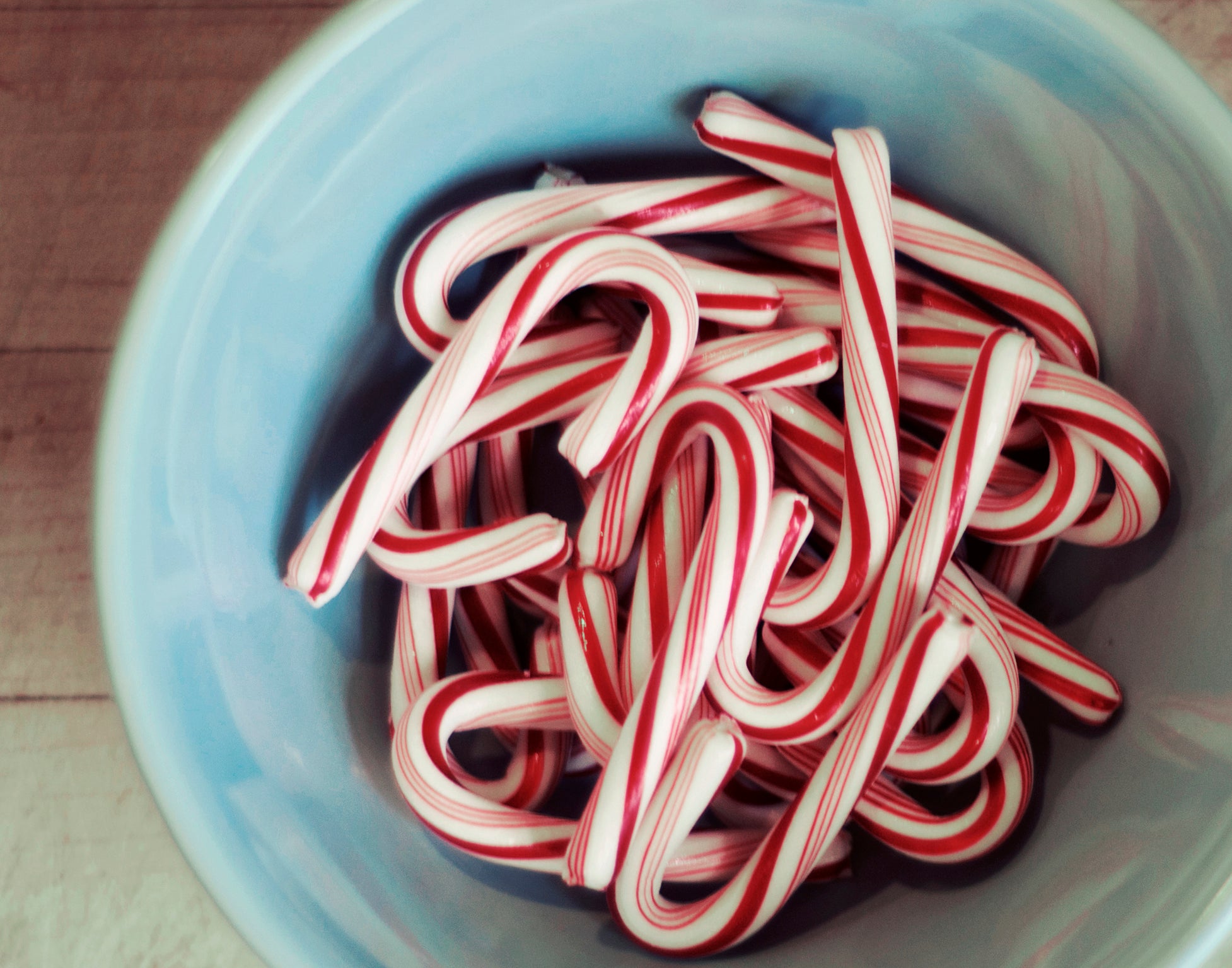 Candy canes in blue bowl