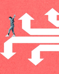 Girl balancing on white arrow signs