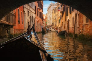 Italy, Veneto, Venice, Gondola under bridge