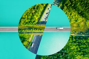 Creative picture montage with a circle shape, connecting different roads from directly above evoking sustainability.