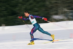 Man cross country skiing, side view