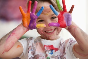 Messy Caucasian girl in art class