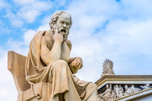 Ancient marble statue of the great Greek philosopher Socrates on background the blue sky