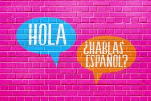 A wall, language school and question Speak Spanish
