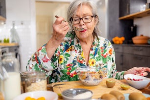 active senior woman is enjoying her healthy breakfast