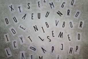 Typography Letters Over Black Background