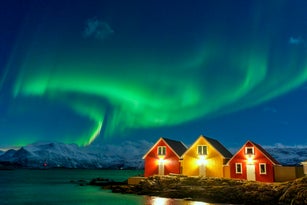 Traditional rorbu during the Northern Lights