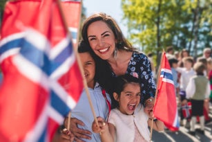 Portrait of happy family celebrating Norwegian National Day