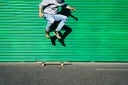 Green wall skater - stock photo
