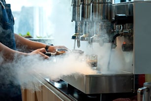 Making a cup of hot coffee.