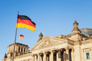 Germany, Berlin, Regierungsviertel, Reichstag building with German Flags