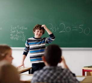Boy making presentation in classroom