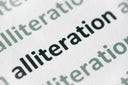 word alliteration  printed on paper macro