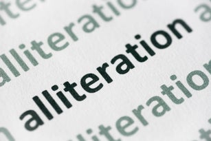 word alliteration  printed on paper macro