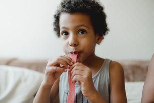 Boy eating sweet