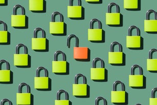 An Opened Lock Standing Out From Locked Locks