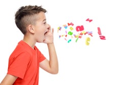 Young boy in bright red T-shirt shouting out alphabet letters. Speech therapy concept over white background.
