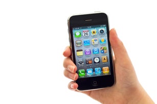 Female hand holding iPhone isolated on white