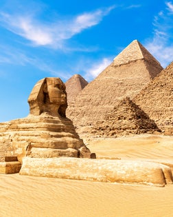 The Sphinx by the Pyramids of Giza in the desert of Egypt