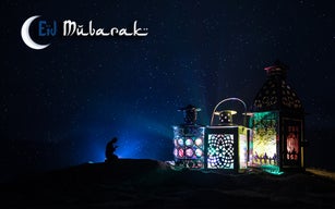 Ornamental Arabic lantern with burning candle glowing at night. Festive greeting card, invitation for Muslim holy month Ramadan Kareem.